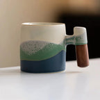 Handmade Ceramic Mug with Wooden Handle – Textured Pottery Coffee Cup in Nature-Inspired Colors 0