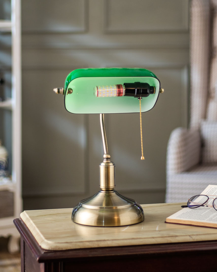 Overhead angle of emerald green banker table lamp polished brass base