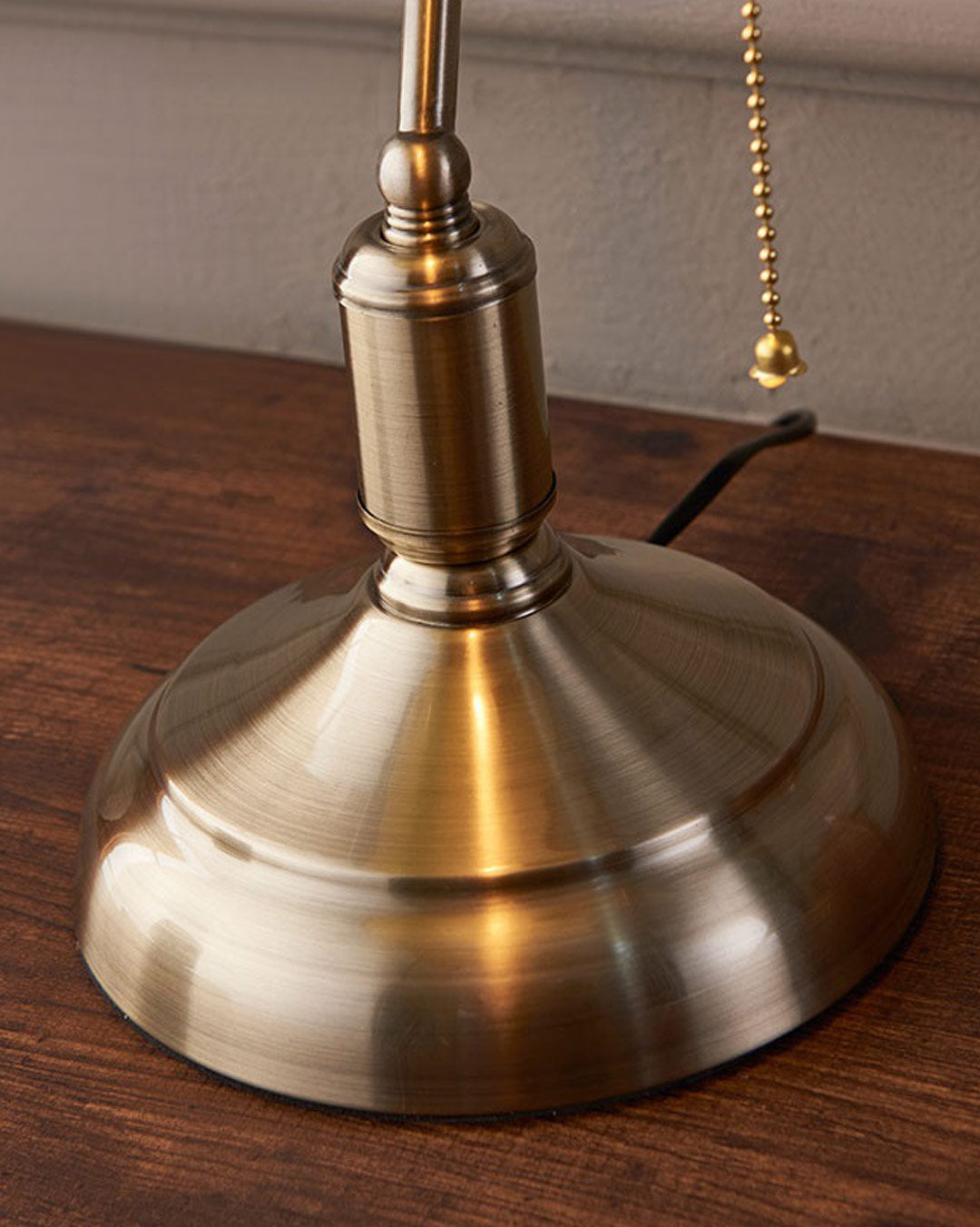 Emerald green banker table lamp styled on wooden writing desk